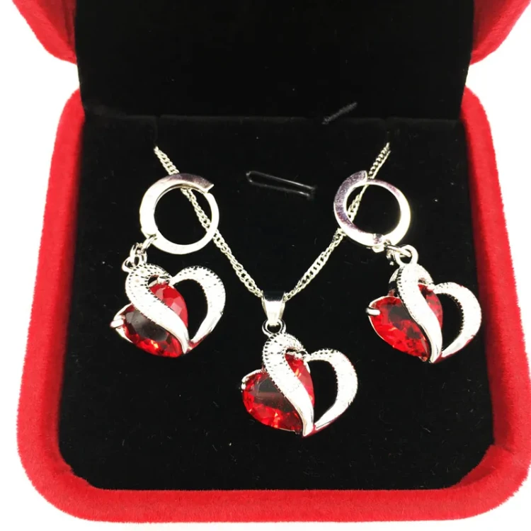 Luksusowy zestaw biżuterii marki "Bamuer"— naszyjnik i kolczyki ze sterlingowego srebra 925 (Silver Plated) w kształcie serca z granatową cyrkonią.