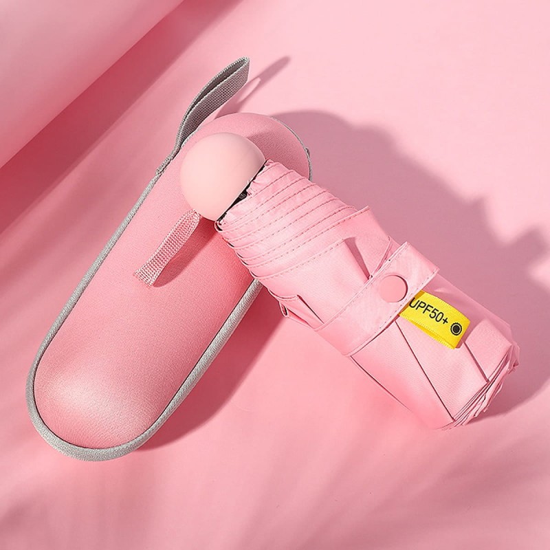 Różowy składany parasol w etui kapsułowym – mini parasolka do torebki z ochroną UV UPF 50+, idealna na prezent.