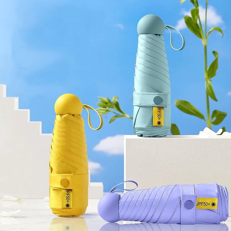 Żółta mini parasolka w kapsule z ochroną UV50+ i etui na suwak. Stylowy, praktyczny gadżet do torebki lub na prezent.