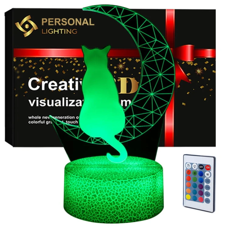 Lampka nocna 3D LED USB z motywem kota na księżycu – biała podstawa i kolorowe światło LED.